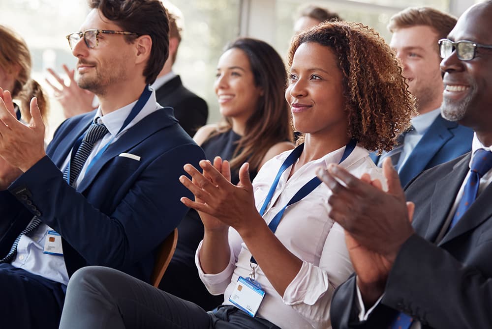 Conference attendees applauding